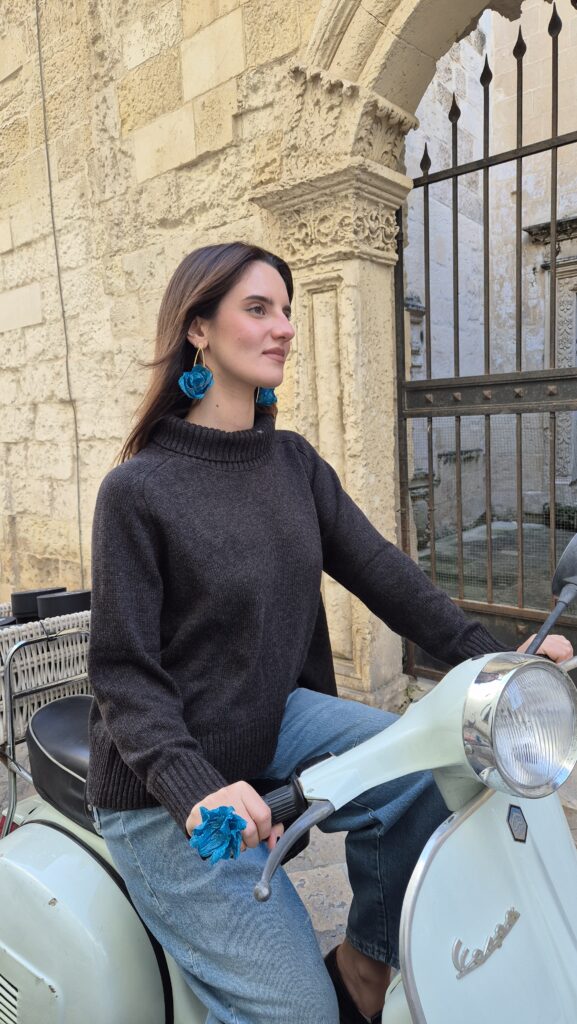 Paper-mache earrings worn on a Vespa in Lecce